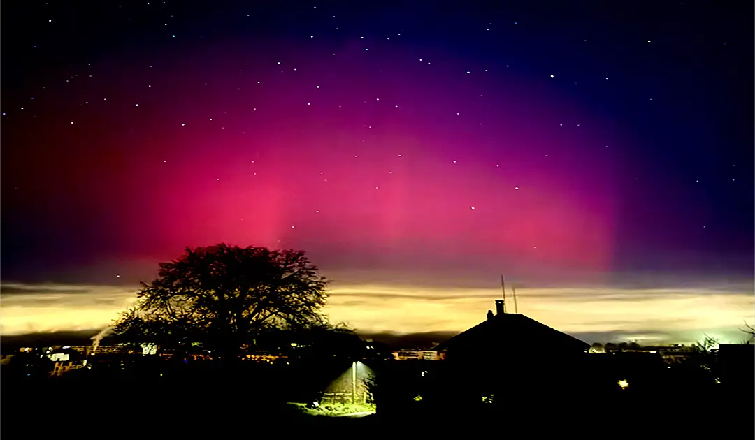 Unexpected Celestial Fire – Northern Lights over the City of Zurich